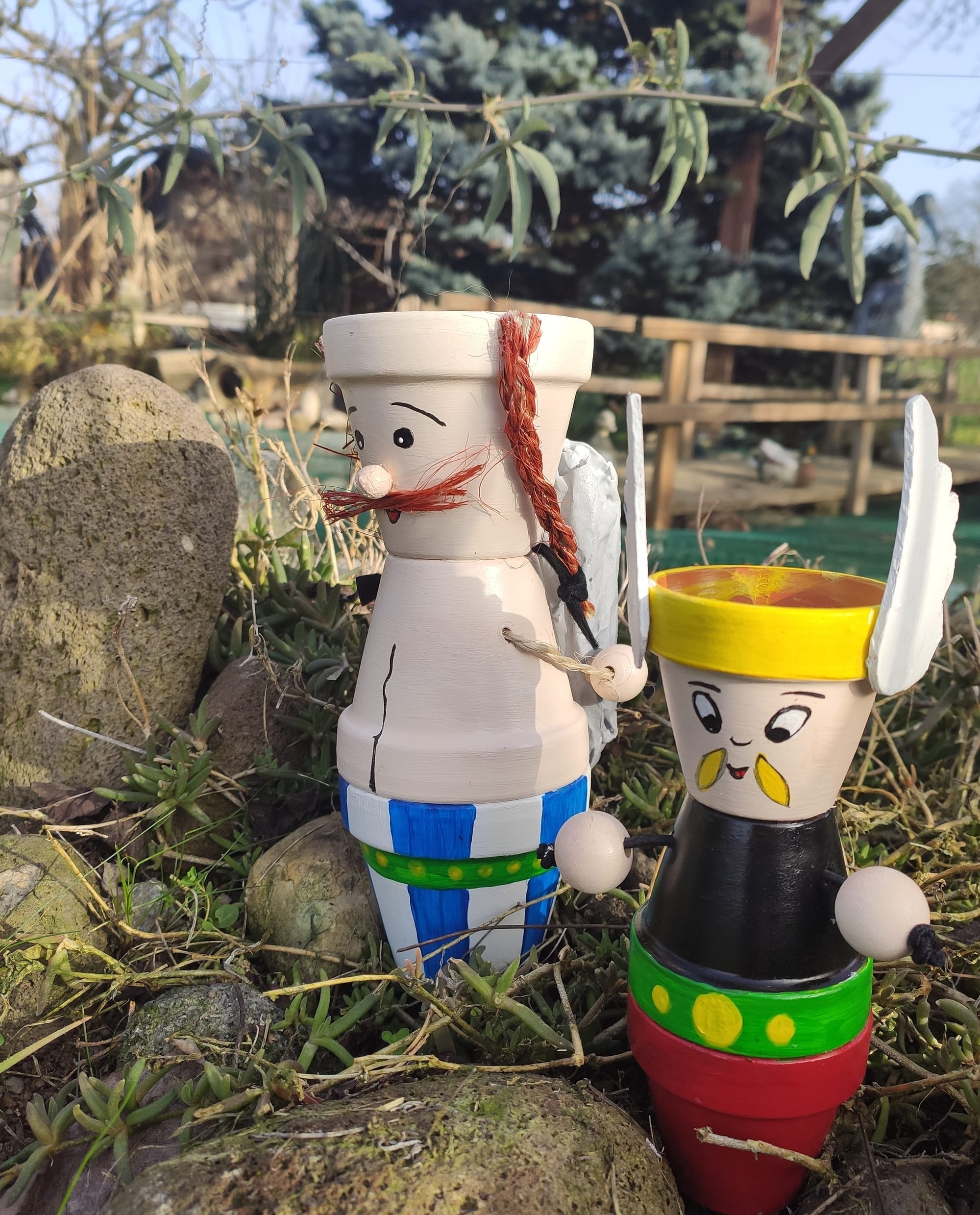 personnage en pot en terre cuite
